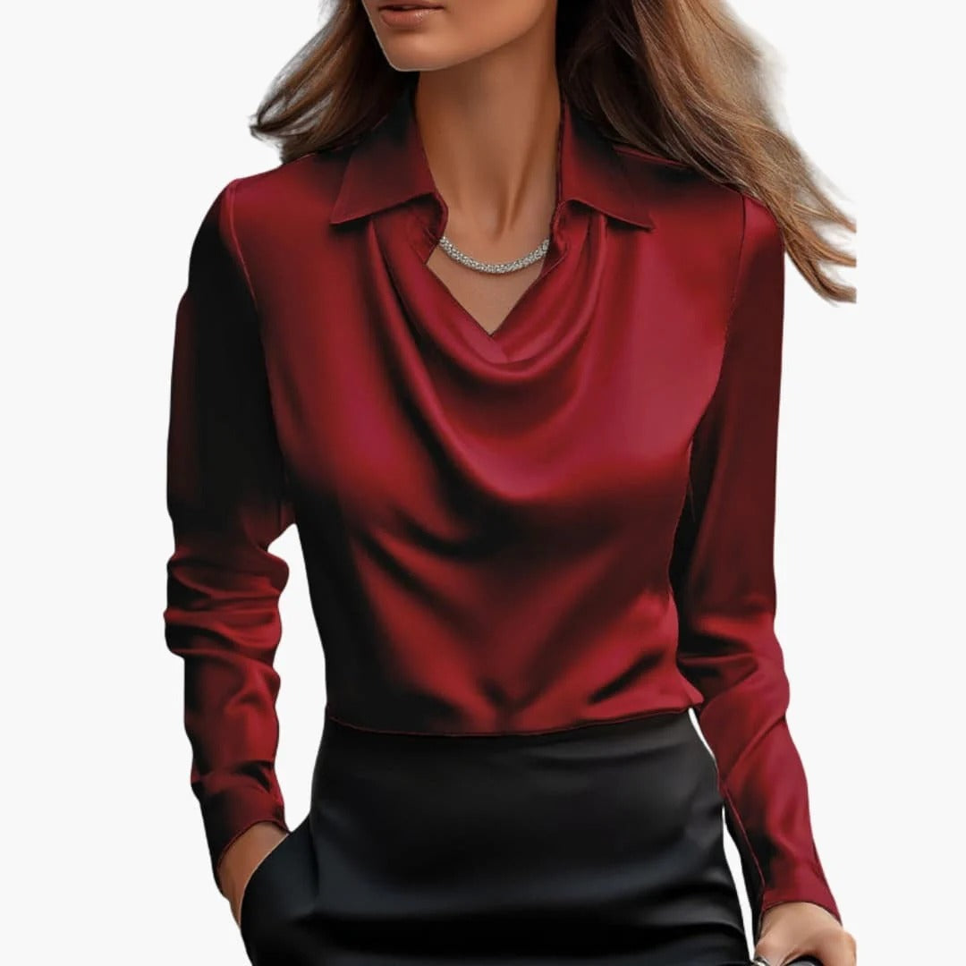 Women's satin blouse with draped neck and long sleeves.